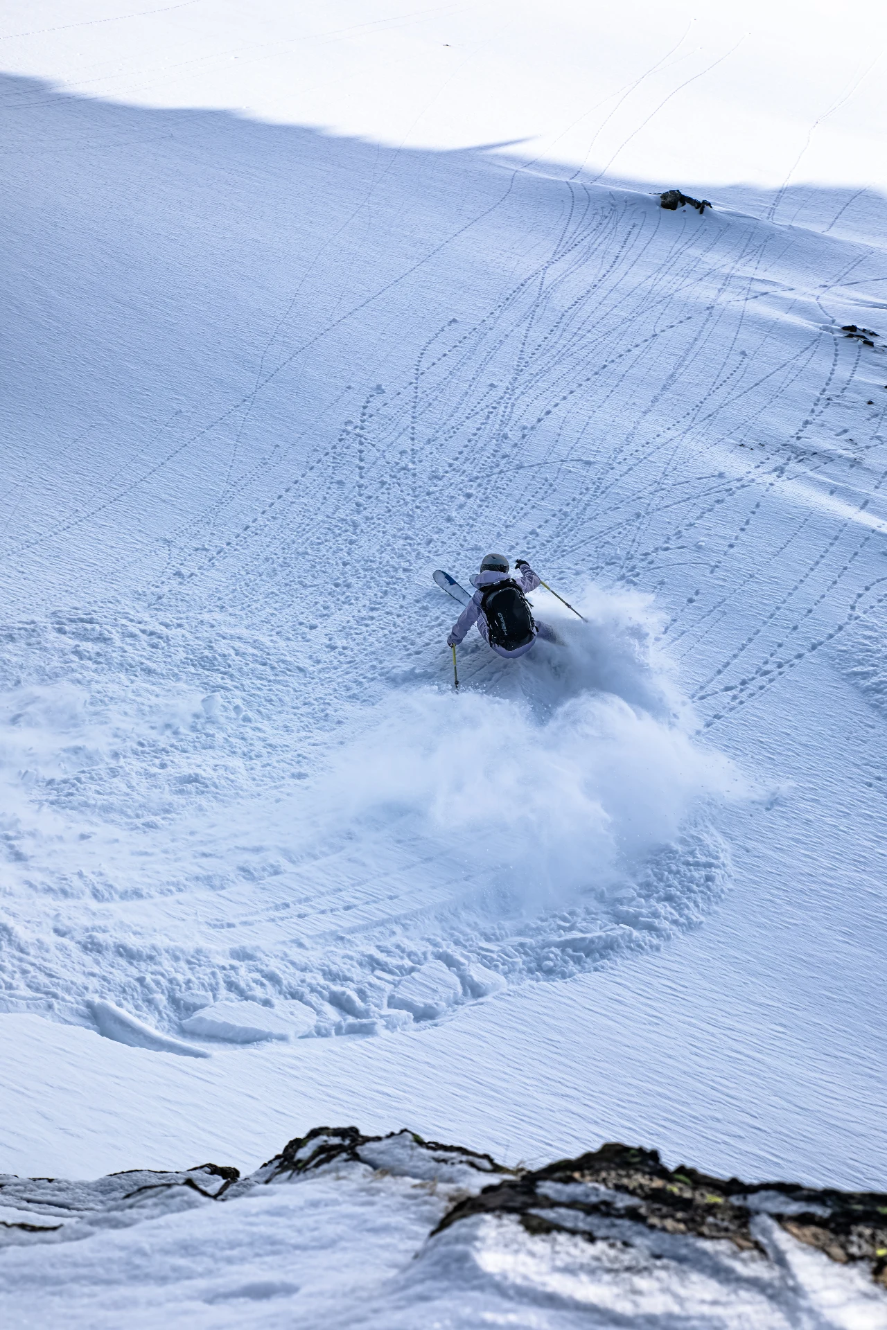 Andrea Limbacher in a deep-snow turn in Lenzerheide